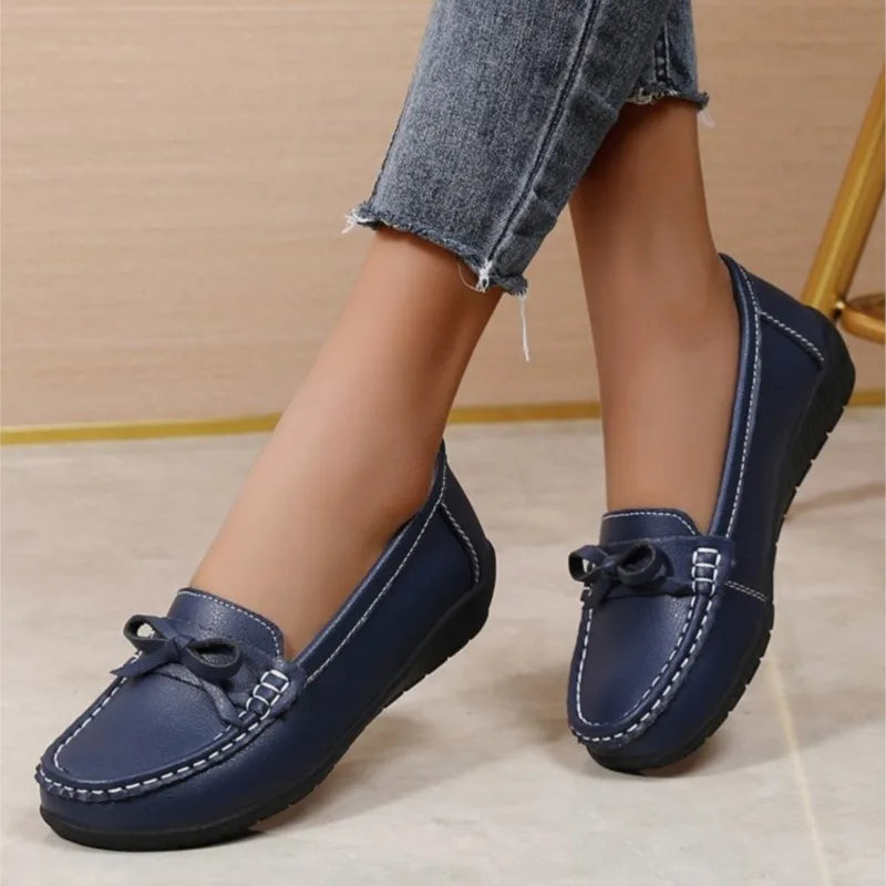 Stylish breathable leather flats for women – comfy casual wear.