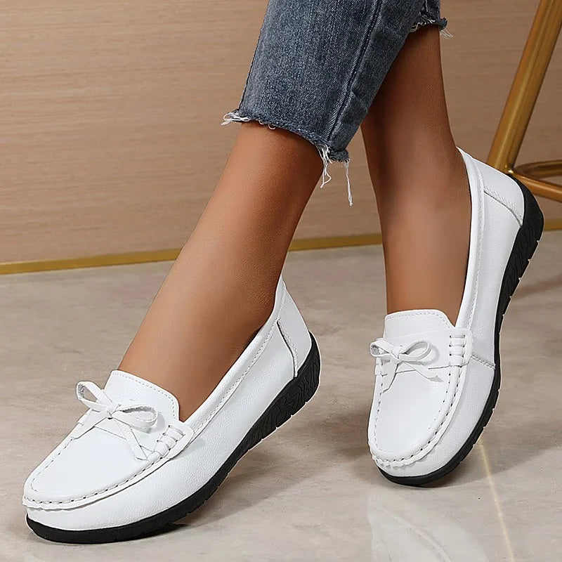 Stylish breathable leather flats for women – comfy casual wear.