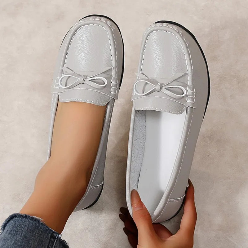 Stylish breathable leather flats for women – comfy casual wear.